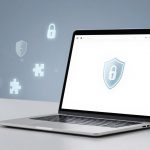 Open laptop on a white desk, displaying a shield with a lock icon on the screen. Background features floating lock and puzzle icons.