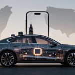 A car with a digital circuit design on its body is shown in front of a large smartphone and city skyline silhouette. Maps of Taiwan and the USA are in the background, set against a dusk sky.