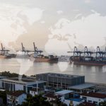 Aerial view of a busy port with multiple cargo ships docked at piers, cranes visible above. In the foreground, a cityscape with modern buildings. A translucent world map overlays the scene.