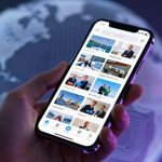 A hand holding a smartphone displaying a news app with various articles and images. The background shows a blurred globe with a digital overlay.
