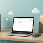 A laptop displaying a file management interface is on a wooden desk. Two gray file holders with documents are on either side. A smartphone lies nearby, and cloud icons hover above, with a padlock symbol. The background is a light blue wall.