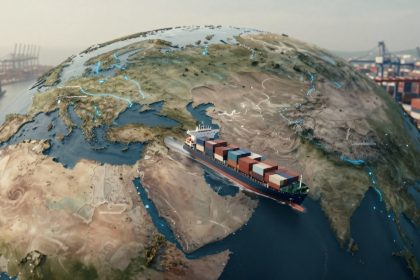 A large container ship sails on a stylized globe, passing between Europe and Asia. The ship carries multicolored cargo containers. A port with cranes and stacked containers is visible in the background. Bright blue lines highlight routes on the globe.