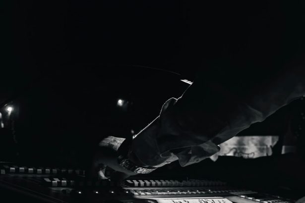 Studio mixing console in black and white, illustrating disclosure of AI-generated music on streaming platforms